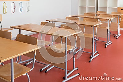 Classroom with wooden desks and chairs Stock Photo