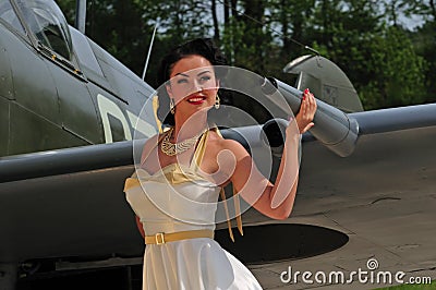 Classy woman with British WWII aircraft Stock Photo