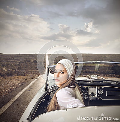 Classy woman in a vintage car Stock Photo
