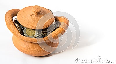 Clay casket full of coins for economy concept Stock Photo