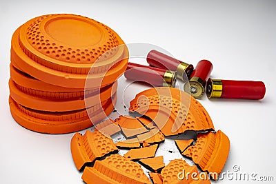 Clay disc flying targets and shotgun bullets on white background ,Clay Pigeon target Stock Photo