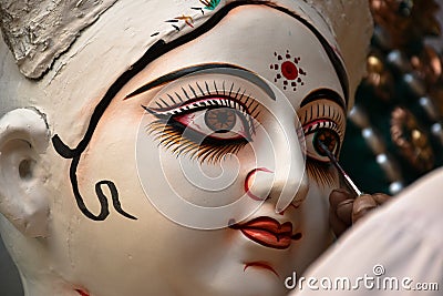 Clay image making,Clay artist,painting eye, Goddess Saraswati ,Kumartuli Stock Photo