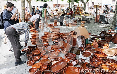 Clay pots, plates and pots at a pottery fair in Zamora. Editorial Stock Photo