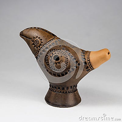 Clay toy whistle in the form of a bird. Stock Photo