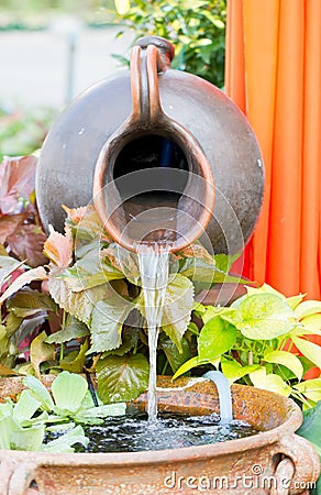 Clay Water Feature With Pond. Stock Photo