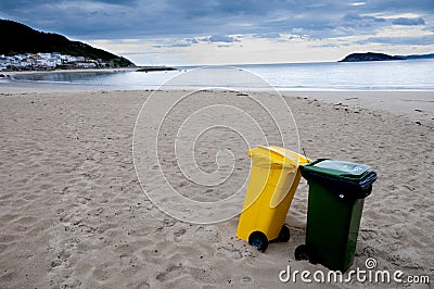 Clean beach and recycling bins. Stock Photo