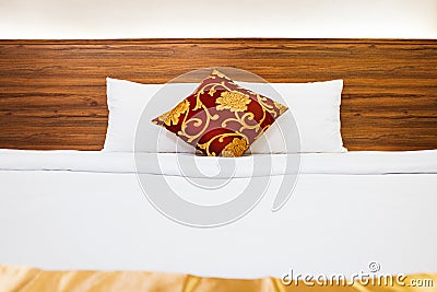 White bedding and pillow in hotel room, Clean Bedding sheets and pillow on natural wall Stock Photo