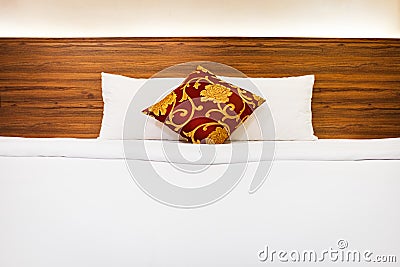 White bedding and pillow in hotel room, Clean Bedding sheets and pillow on natural wall Stock Photo