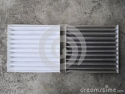 Clean and dirty air filter for air condition in car.Comparison between new and used air filter for car, automotive spare part. Stock Photo