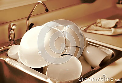 Clean dishes in sink Stock Photo