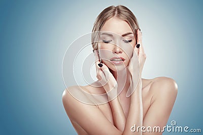 Clean face of beautiful teen girl touching her cheeks Stock Photo