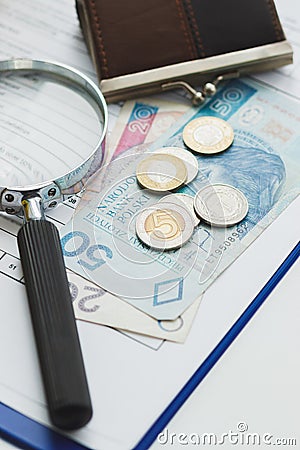 Clean insurance blank, Polish zloty, magnifying glass and wallet Stock Photo