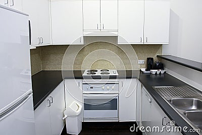 Clean kitchen area in hotel room Stock Photo