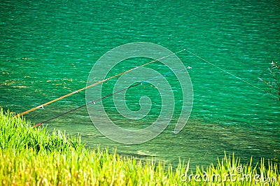 A clean lake and two fishing rod Stock Photo