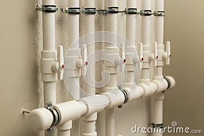 Clean line white water pipes watering system pipe engineer design in underground. plastic white pipe heating manifold Stock Photo