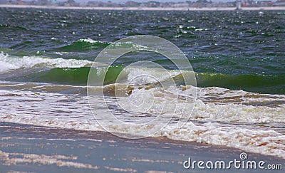 Clean ocean wave rolling curling lip crashing on shallow sandbars Stock Photo