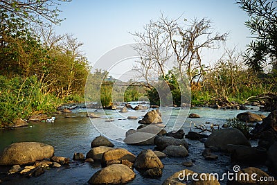 Clean, quiet water stream running over rocks Stock Photo