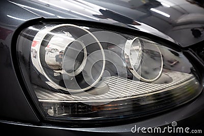 Clean and restored car headlight after restoration Stock Photo