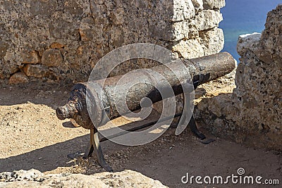 Clean shoot of old iron made black cannonball in the castle Stock Photo