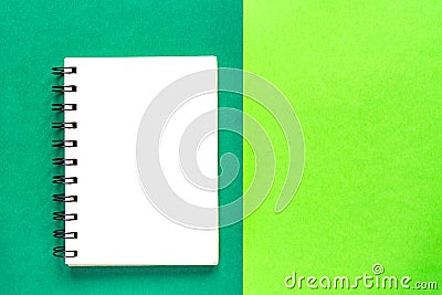 Clean spiral note book for notes on green background. Minimal business flat lay mock up Stock Photo