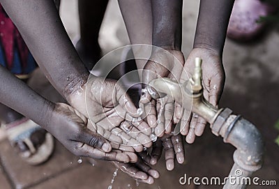 Clean Water Splashing Into African Child`s Hands Life Metaphore. Stock Photo