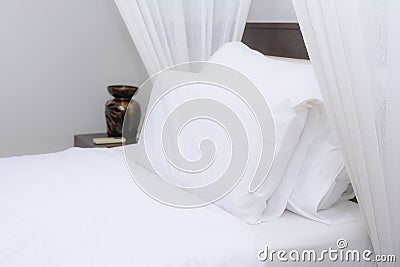 Clean white pillow on the bed Stock Photo