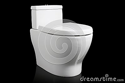 A clean white porcelain toilet home fixture isolated on black background Stock Photo