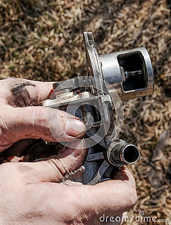 Cleaned Automotive Exhaust Gas Recirculation Valve - egr in Dirty Male Hands Stock Photo