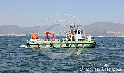 Cleaner ship cleaning water Stock Photo