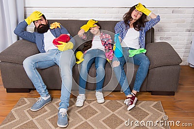Cleaning all day exhausting occupation. Tired parents and kid. Exhausting cleaning day. Family mom dad and daughter with Stock Photo