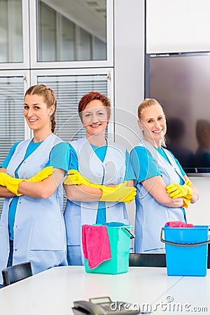 Cleaning brigade working in office Stock Photo