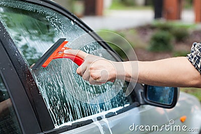 Cleaning car window Stock Photo