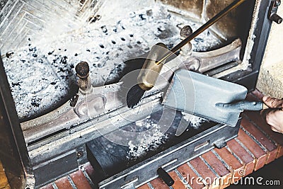 Cleaning fireplace with open tray. Stock Photo