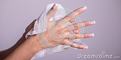 Cleaning hands with wet wipes - prevention of infectious diseases Stock Photo