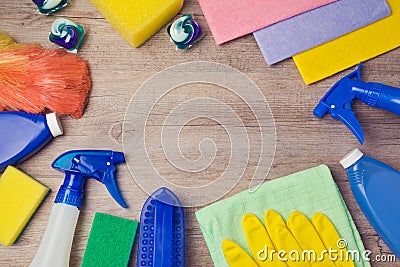 Cleaning and household concept with supplies on wooden background. View from above Stock Photo