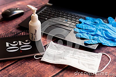 Cleaning kit for remote work home office desk with hand sanitizer and face mask, a solution against the spread of corona virus for Stock Photo