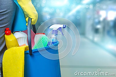 Cleaning lady with a bucket and cleaning products . Stock Photo