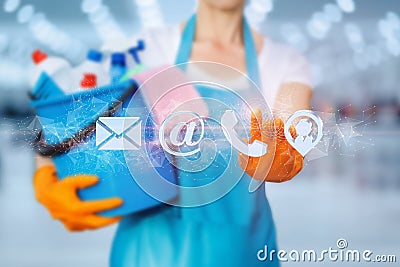 Cleaning lady clicks on the contact icon on a blurred background Stock Photo