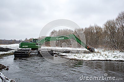 Cleaning of the Pekhorka River of silt Editorial Stock Photo