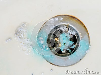 Cleaning plug hole with chemicals Stock Photo