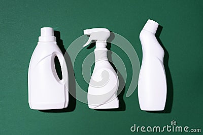 Cleaning products on green background. Top view. Copy space. Chemical cleaning supplies. Stop plastic, recycling Stock Photo