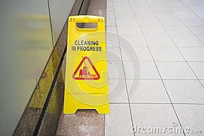 Cleaning progress caution sign in public toilet Stock Photo