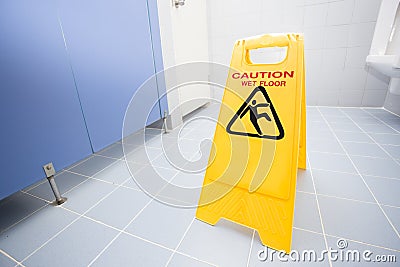 Cleaning progress caution sign in toilet Stock Photo