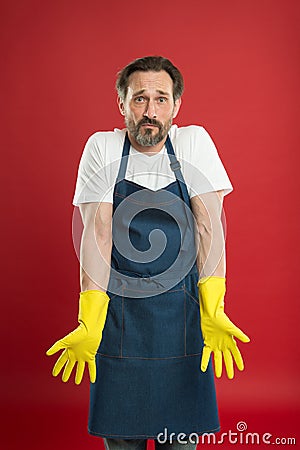 Cleaning service and household duty. Lot of work. Gardening concept. Man in apron with gloves cleaning agent. Cleaning Stock Photo