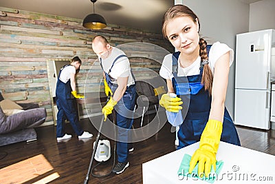 Cleaning service with professional equipment during work. professional kitchenette cleaning, sofa dry cleaning, window Stock Photo