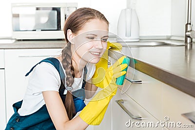 Cleaning service with professional equipment during work. professional kitchenette cleaning, sofa dry cleaning, window Stock Photo