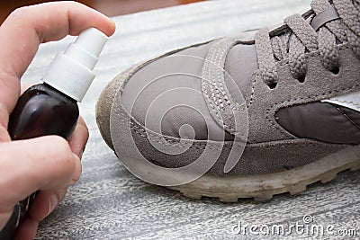 Cleaning shoes,washing the dirty sneakers , cleaning the shoes Stock Photo