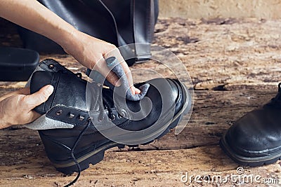 Cleaning shoes on wooden background Stock Photo