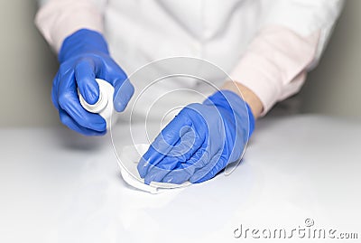 Cleaning table with disinfectant spray and Microfiber close up for covid preventing Stock Photo