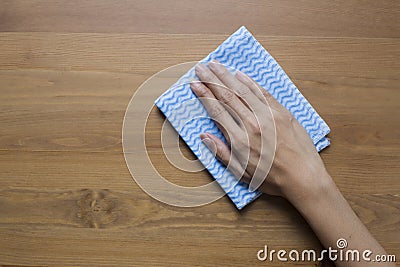 Cleaning table by woman hand Stock Photo